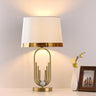 LustreOval Tischlampe | Modernes Luxusdesign | Goldene Ovalbasis & Stoffschirm | 1-Licht Tischleuchte für stilvolle Räume